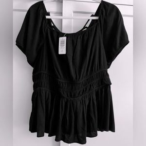 NWT TORRID Sz 14/16 Black Short-Sleeved Top w/ Criss-Cross Design at back.